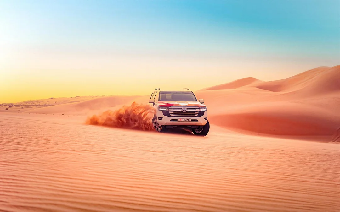 Abu Dhabi Evening Desert Safari with 4x4 Dune Bashing, Camel Ride, & BBQ Dinner Image 1