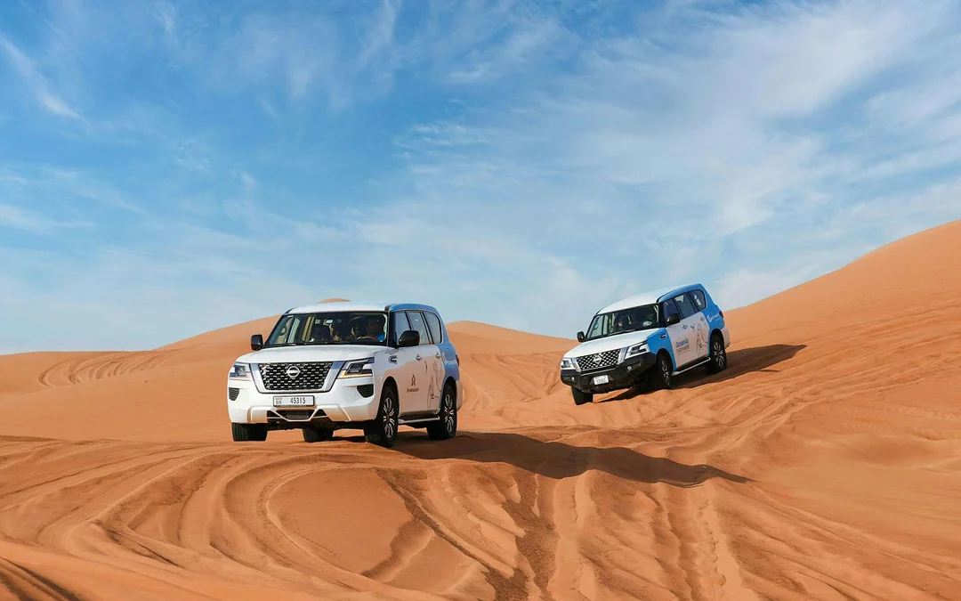 Abu Dhabi Premium Desert Safari with BBQ Dinner, Camel Ride and Sandboarding Image 1