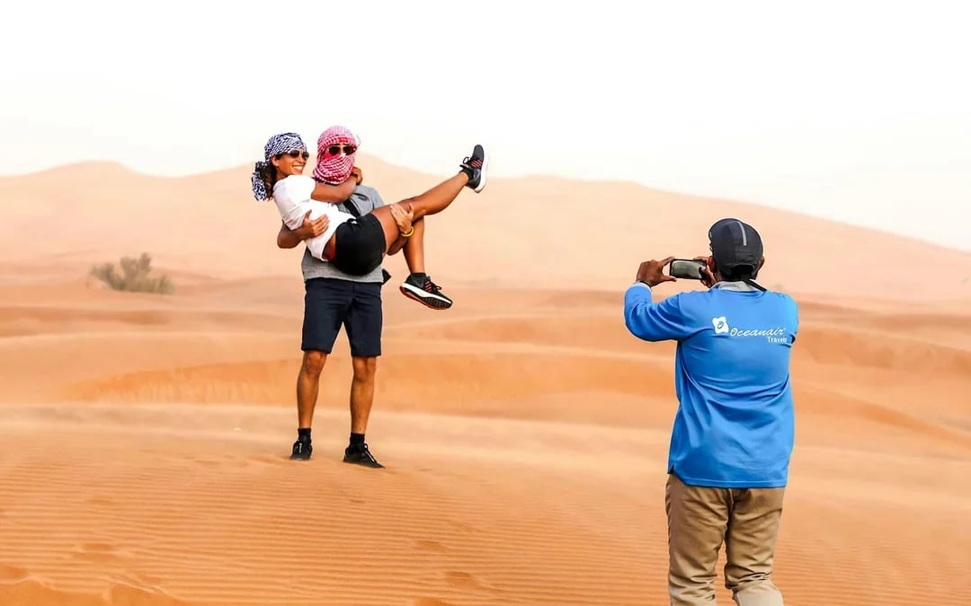 Abu Dhabi Premium Desert Safari with BBQ Dinner, Camel Ride and Sandboarding Image 8