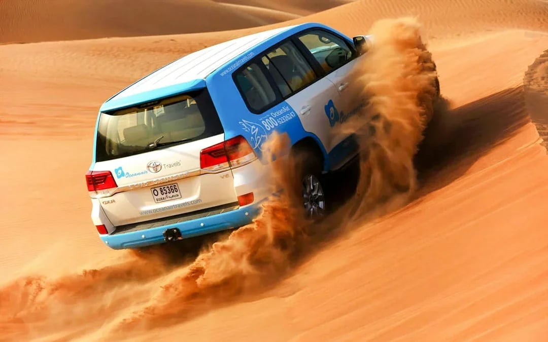 Abu Dhabi Premium Desert Safari with BBQ Dinner, Camel Ride and Sandboarding Image 9