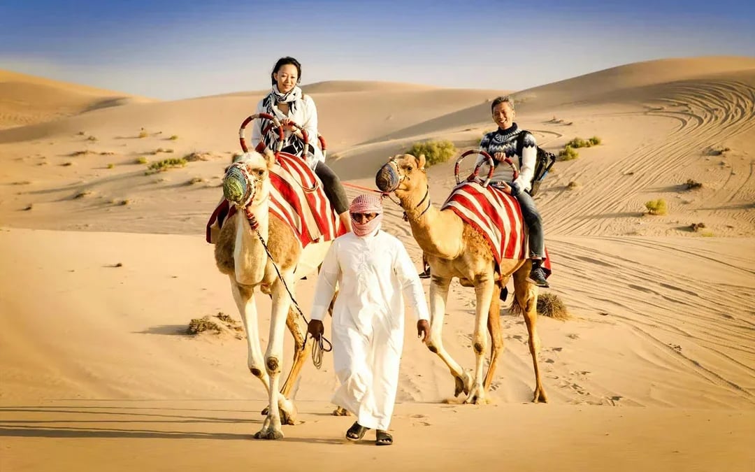 Abu Dhabi Premium Desert Safari with BBQ Dinner, Camel Ride and Sandboarding Image 10
