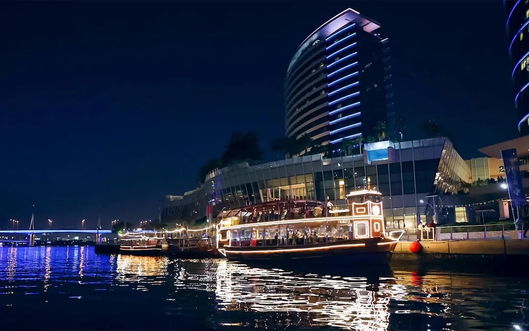 Dine & Dazzle Evening Package: Dubai Canal Dinner Cruise with Unlimited Drinks + La Perle Show Image 9