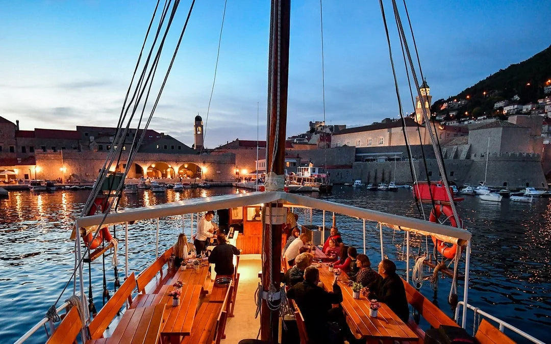 Dinner Cruise in Front of Dubrovnik City Walls at Sunset Image 1