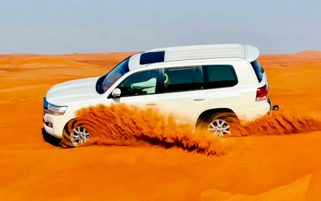 Dubai Evening Desert Safari with 4x4 Dune Bashing, BBQ Dinner, Live Shows & Hotel Transfers Image 1