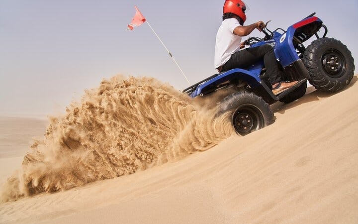 Dubai Evening Desert Safari with Dune Bashing, Camel Ride, Sandboarding, Live Shows & BBQ Dinner Image 2