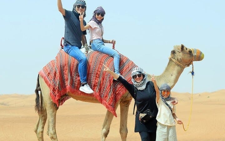 Dubai Evening Desert Safari with Dune Bashing, Camel Ride, Sandboarding, Live Shows & BBQ Dinner Image 3