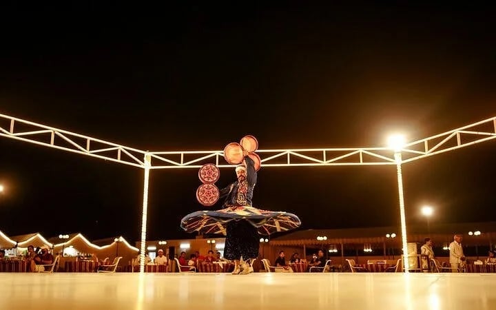 Dubai Evening Desert Safari with Dune Bashing, Camel Ride, Sandboarding, Live Shows & BBQ Dinner Image 5