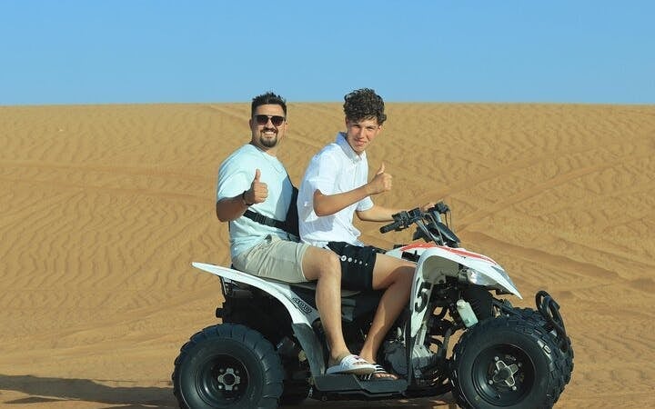 Dubai Evening Desert Safari with Dune Bashing, Camel Ride, Sandboarding, Live Shows & BBQ Dinner Image 6