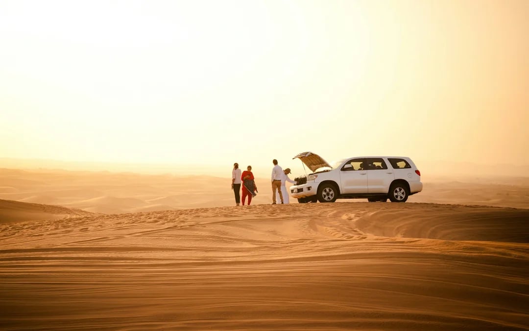 Dubai Morning Desert Safari with Dune Bashing, Sandboarding and Camel Ride Image 1