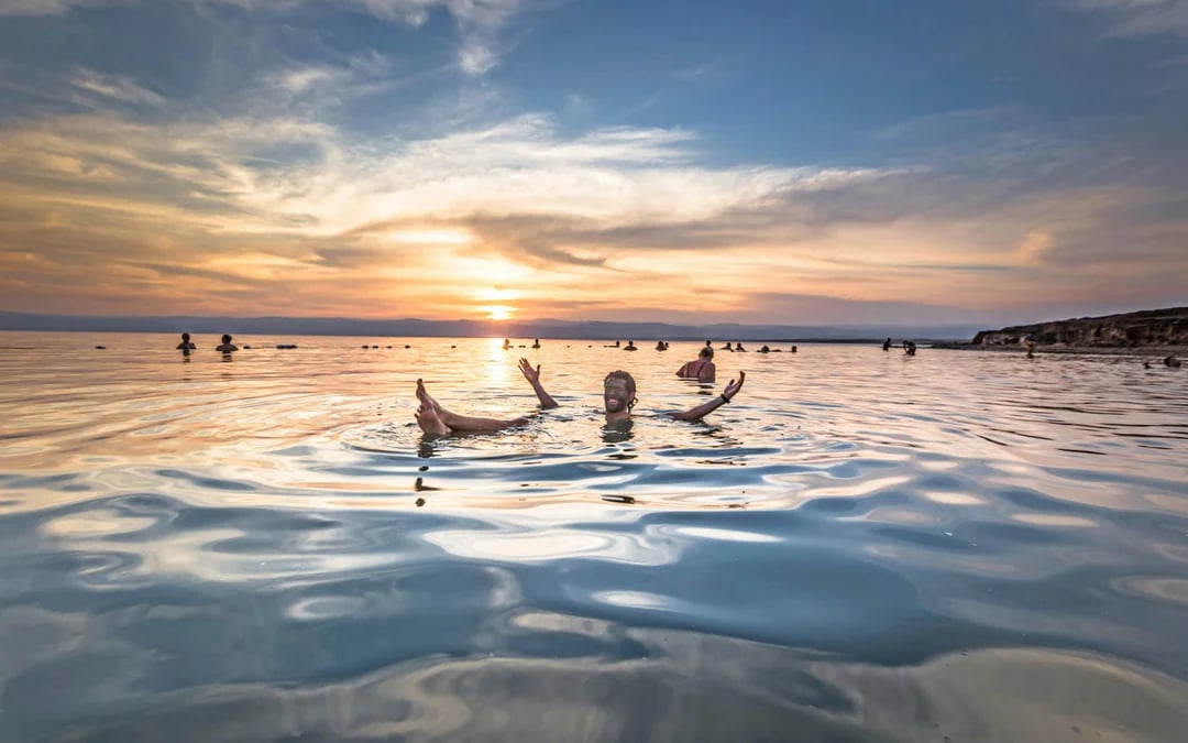 From Amman: Dead Sea Half-Day Trip with 4-Star Resort Beach Access & Mud Experience Image 1