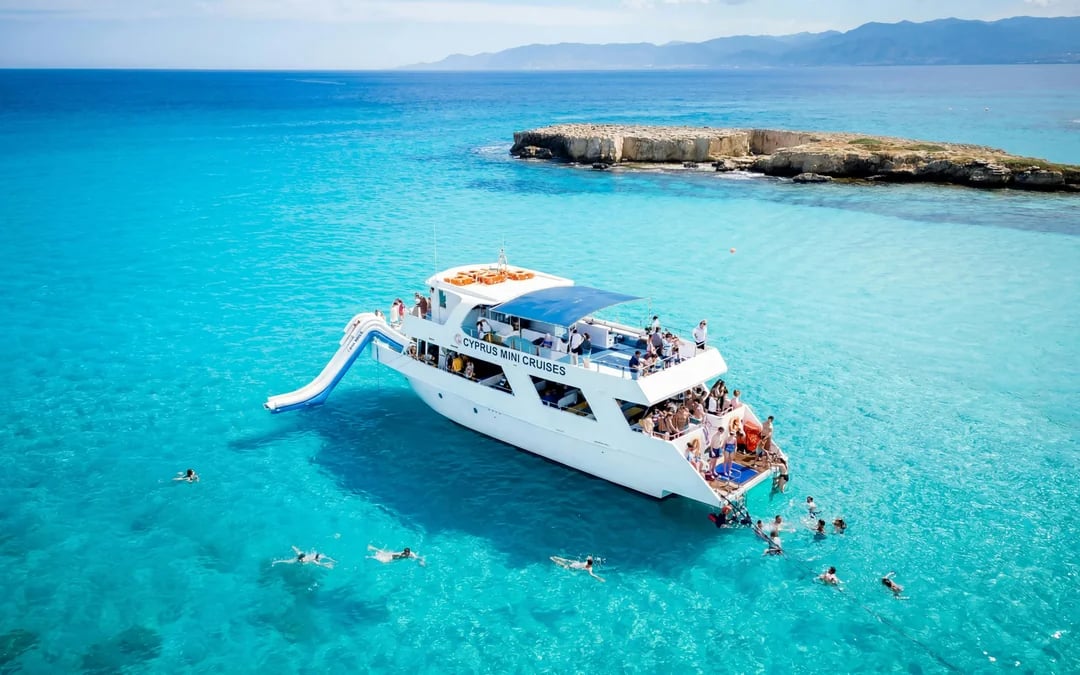 From Paphos: Aphrodite’s Akamas Blue Lagoon Bus & Boat Tour with Waterslide Image 1