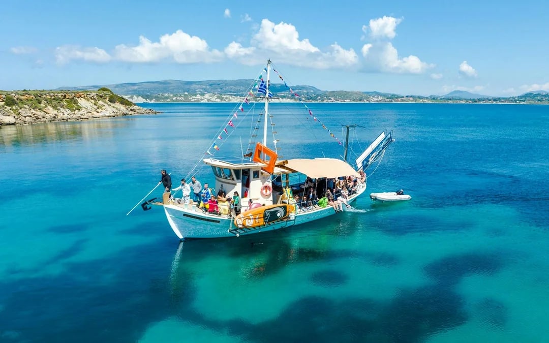 Kefalonia Day Cruise to White Rocks Beach and Vardiani Island with Homemade Greek Cuisine Image 1