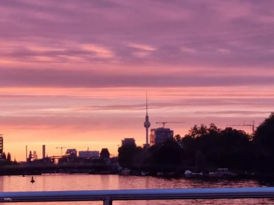 Solar-powered catamaran cruise on Berlin's Spree River at sunset