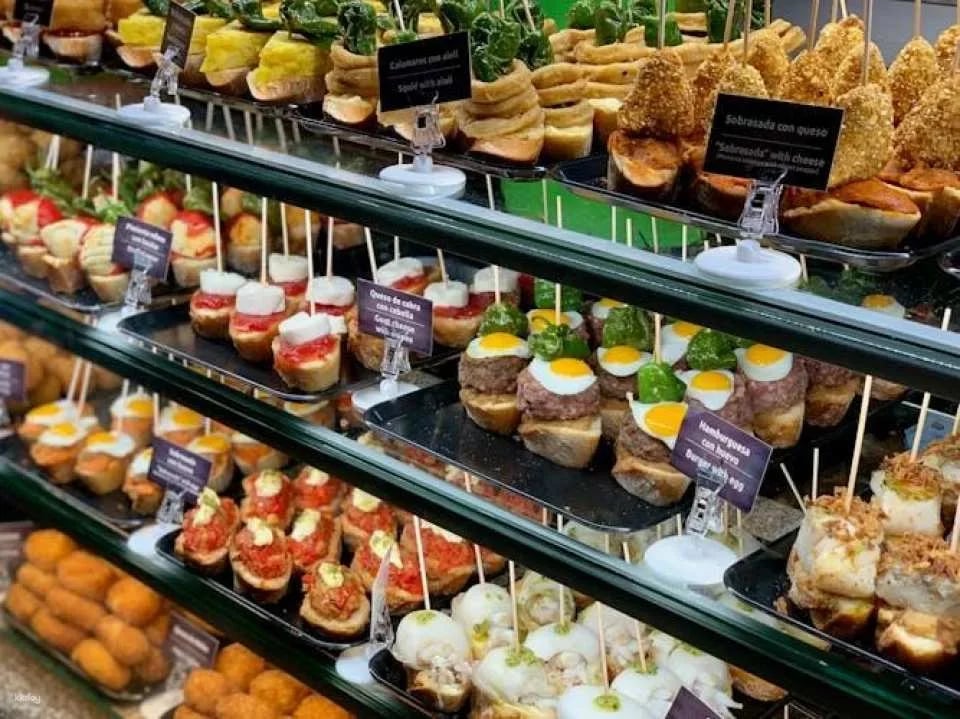 Barcelona district tour with traditional tapas tasting
