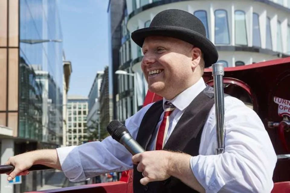 Vintage open-top bus tour with live guide in London