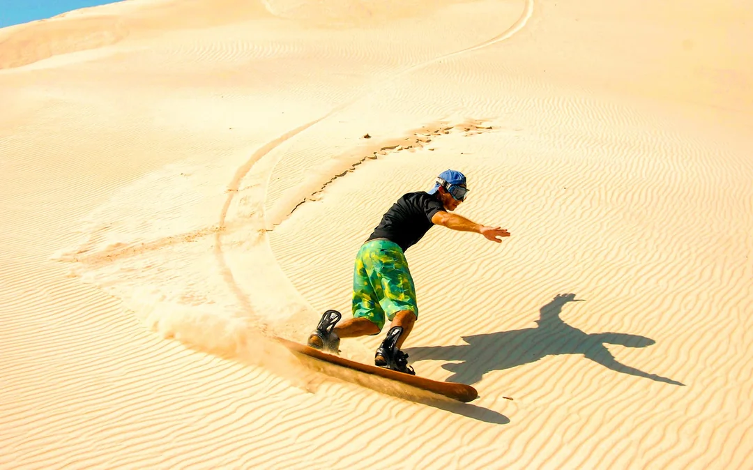 Morning Desert Safari with Camel Farm Visit & Sandboarding Image 4