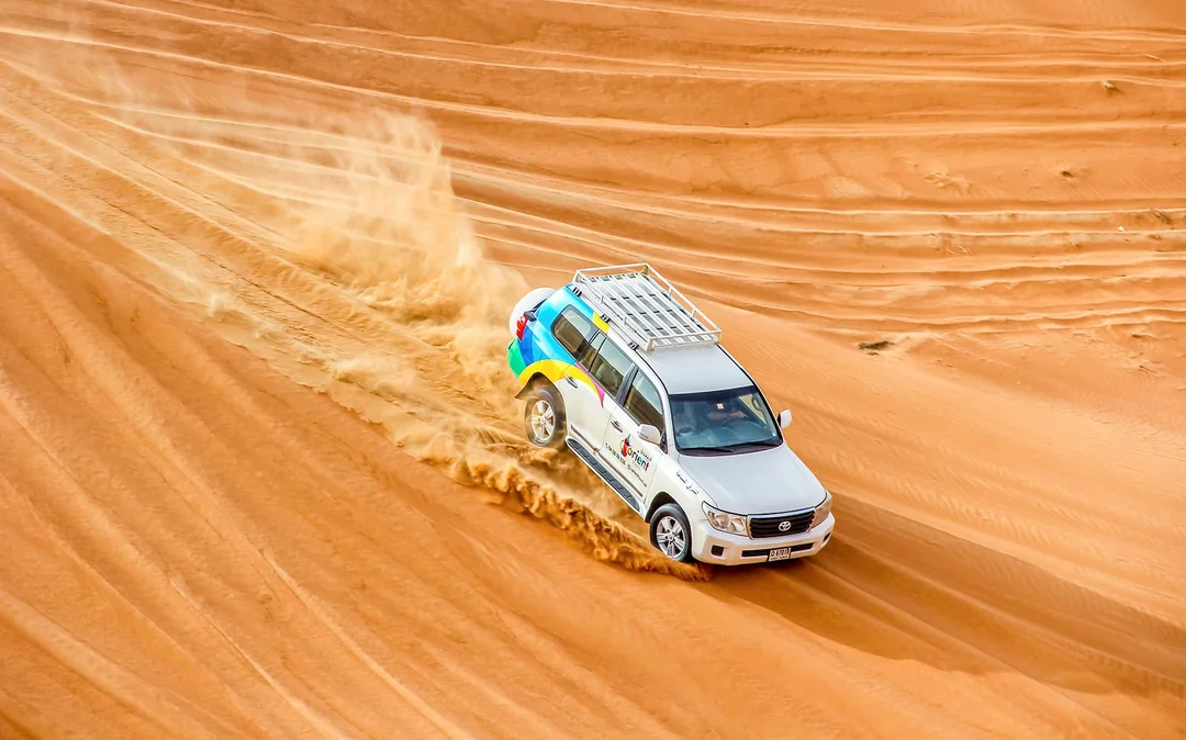 Morning Desert Safari with Camel Farm Visit & Sandboarding Image 5