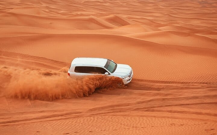 Morning Desert Safari with Dune Bashing, Sandboarding & Camel Ride Image 4