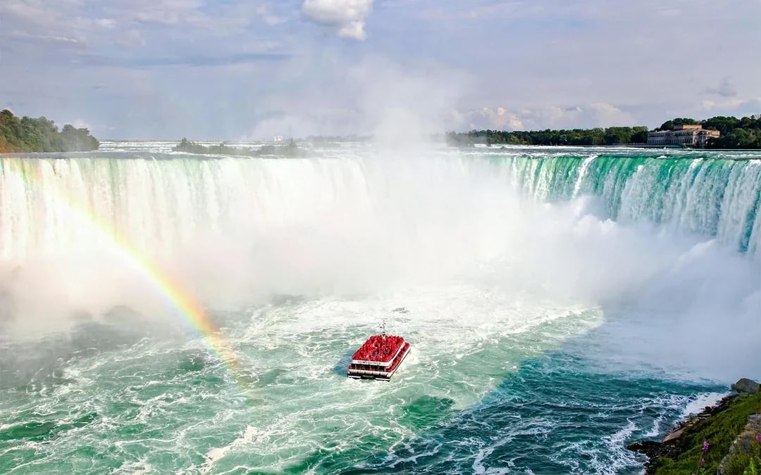 Niagara Falls Canada: Guided Tour with Hornblower Cruise, Journey Behind the Falls & Skylon Tower
Image 1