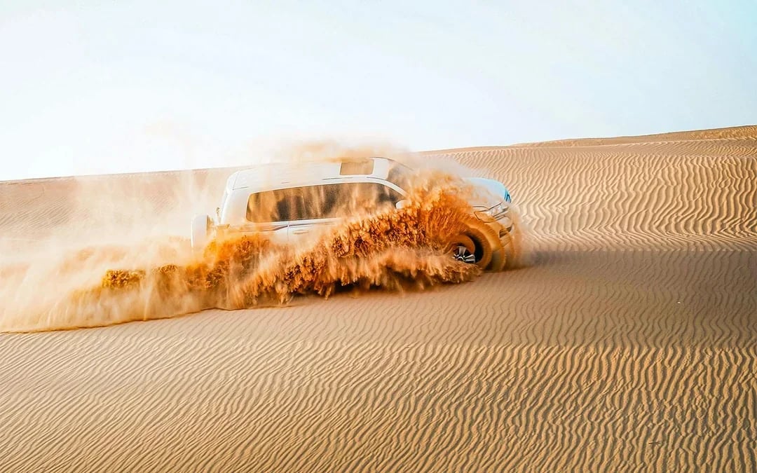 Private Al Khatim Desert BBQ Dinner with Dune Bashing & Hotel Transfers Image 11