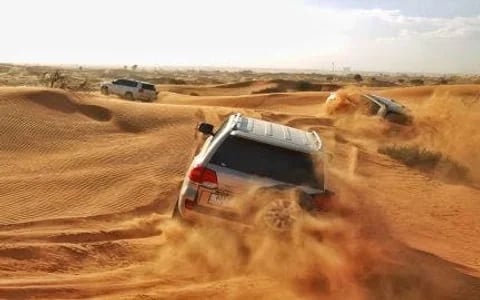 Ras Al Khaimah Desert Safari with Dune Bashing, Camel Ride, Sand Boarding, BBQ Dinner, and Transfers Image 2
