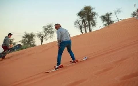 Ras Al Khaimah Desert Safari with Dune Bashing, Camel Ride, Sand Boarding, BBQ Dinner, and Transfers Image 6